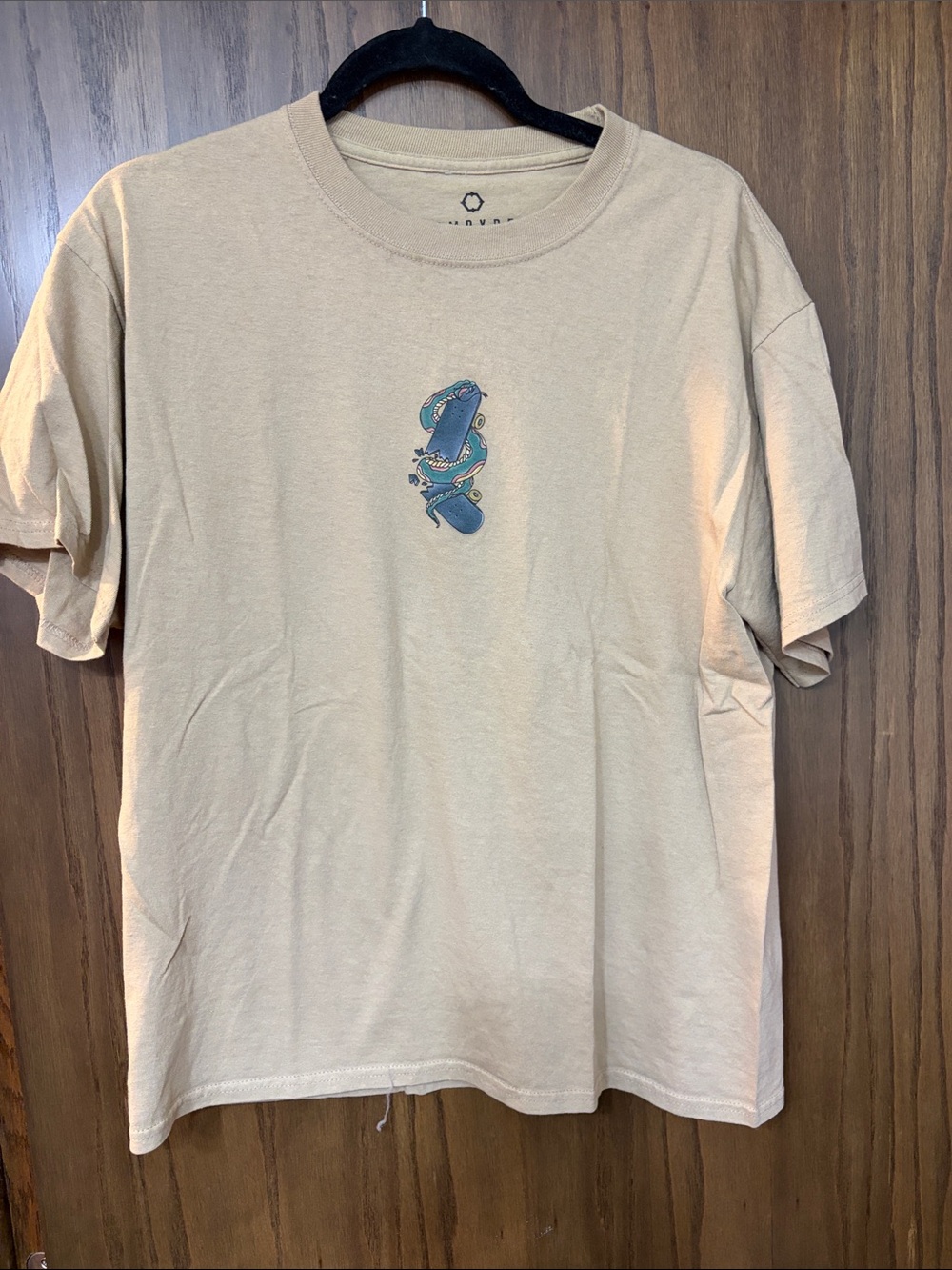 Empyre Beige Short-Sleeve Tee with Small Blue Skateboard Graphic